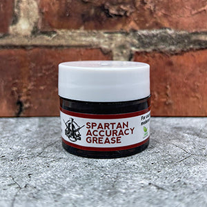 Small jar with white lid and white label that reads, "Spartan Accuracy Grease"
